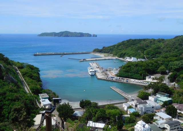 The port of Hahajima and a cluster of buildings that make up part of the small town on the island
