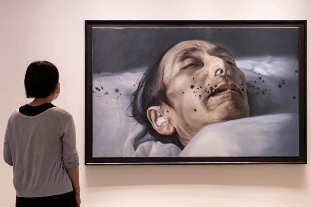 A visitor considers Atsushi Suwa’s confronting Untitled (2010)