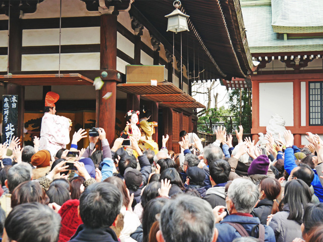 Lucky bean throwing at Kitano Tenmangu Shrine during Setsubun Festival