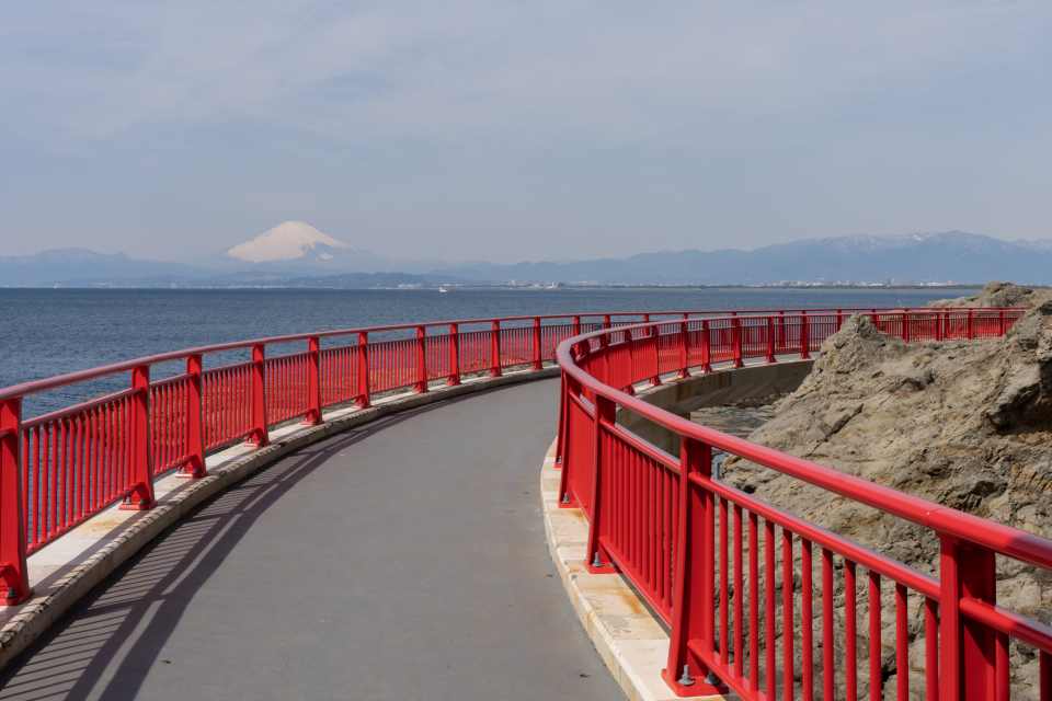The path leading to the Iwaya Caves skirts the rocky face of Enoshima’s west side, allowing great views of Mt. Fuji on a clear day