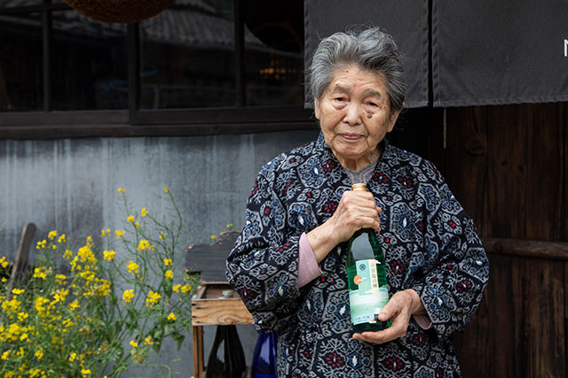 Midori-san proudly shows off her award-winning sake, brewed on Shodoshima