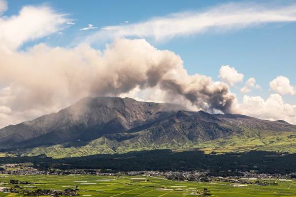 Mt. Aso billowing smoke and ash high into the air