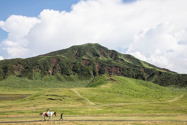 Mt. Eboshi, one of Aso’s non-active peaks sits beyond the open plains of Kusasenri