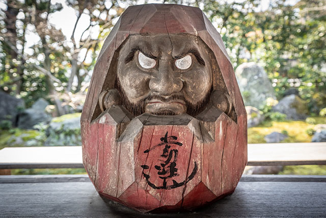 The zen garden, which is situated behind the temple has a few Daruma randomly placed along the way, including this one from Yamagata, which is made of wood, unusually